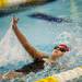 An Arkansas swimmer competes in the 100 mete backstroke on Monday, July 29. Daniel Brenner I AnnArbor.com